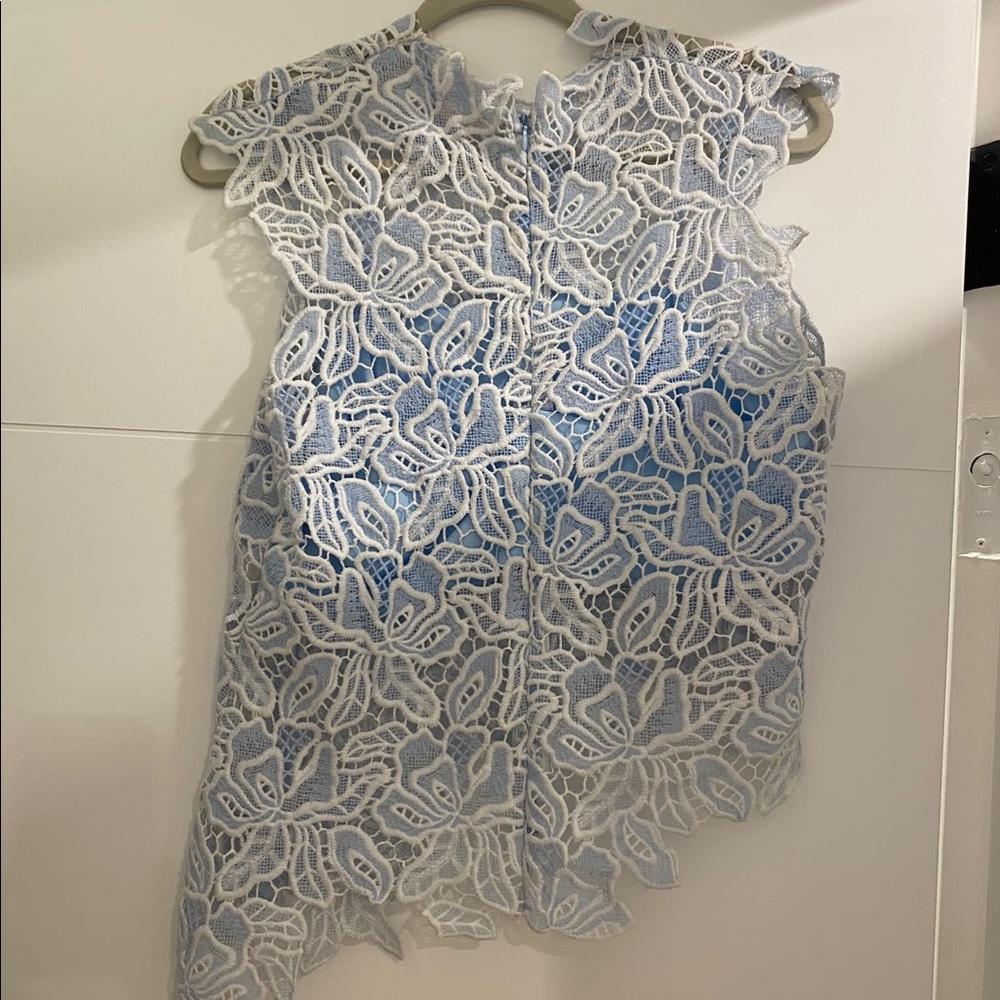 blue luxxel top. size small. worn 2 times, in brand new condition